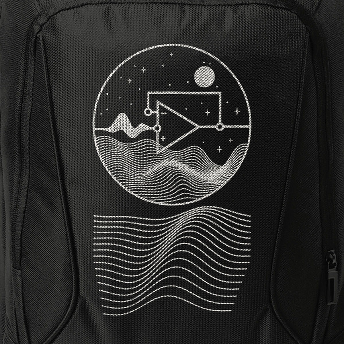 Detail of the printed front panel on black fabric.